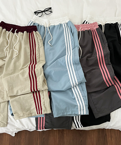 バイカラーラインナイロントレーニングワイドパンツ