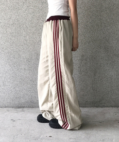 バイカラーラインナイロントレーニングワイドパンツ BEIGE