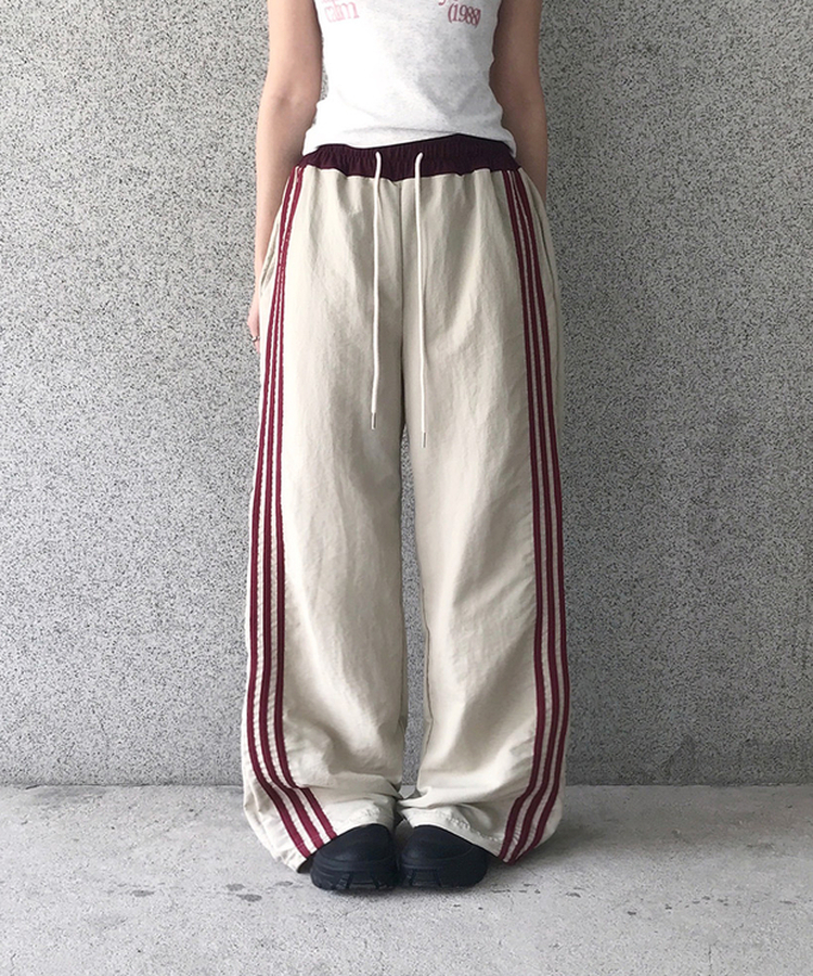 バイカラーラインナイロントレーニングワイドパンツ BEIGE