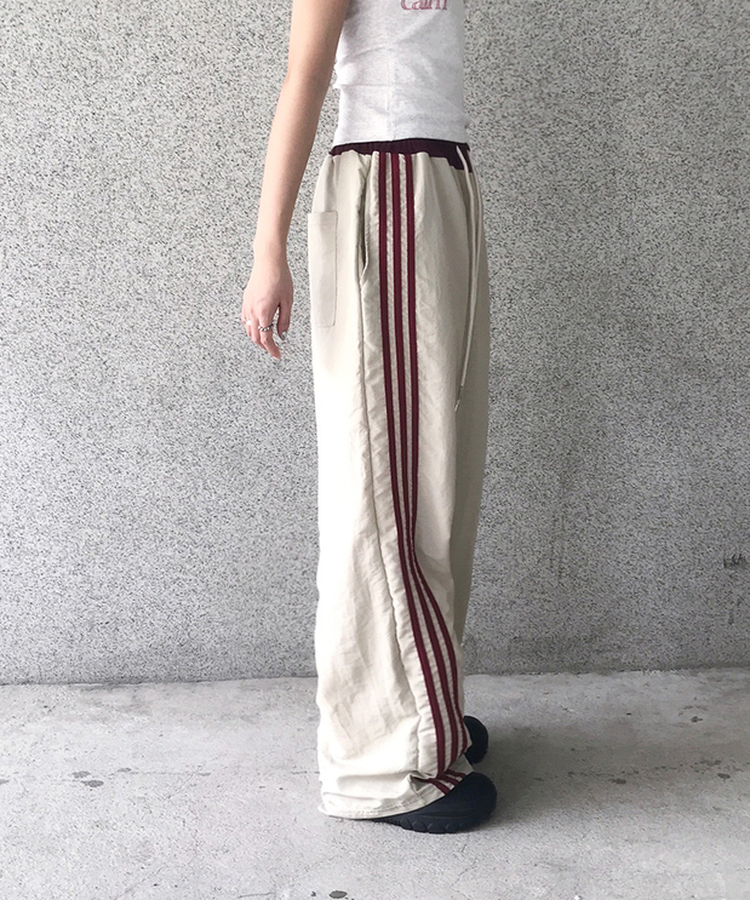 バイカラーラインナイロントレーニングワイドパンツ BEIGE