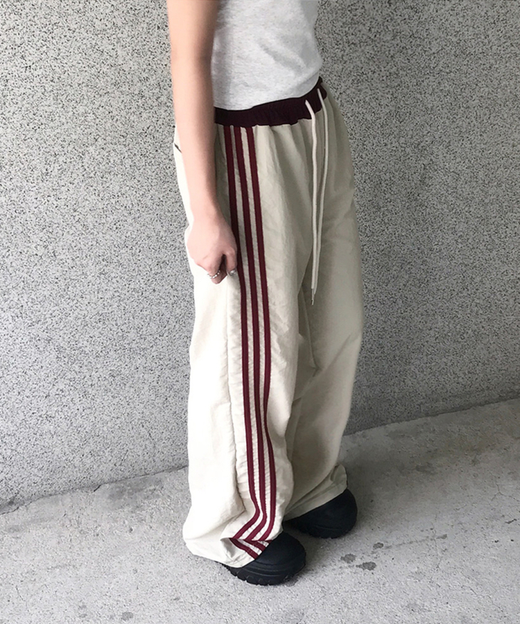 バイカラーラインナイロントレーニングワイドパンツ BEIGE