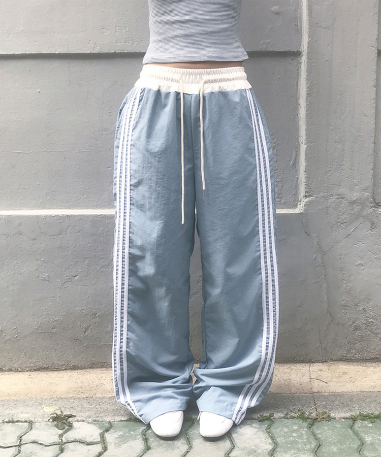 バイカラーラインナイロントレーニングワイドパンツ SKY BLUE