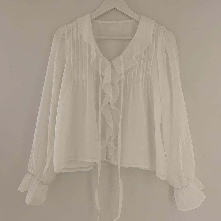 フリルボタンラッフルブラウス