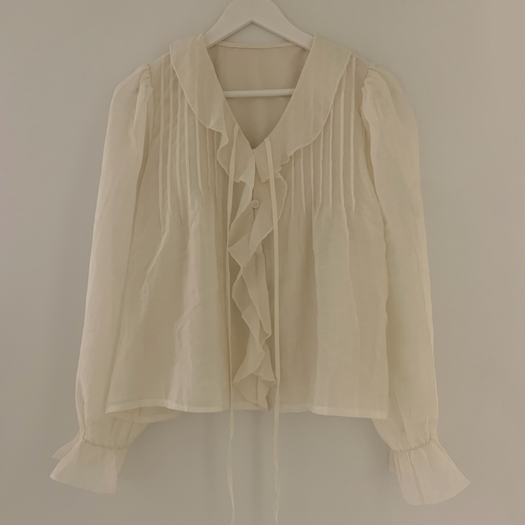 フリルボタンラッフルブラウス
